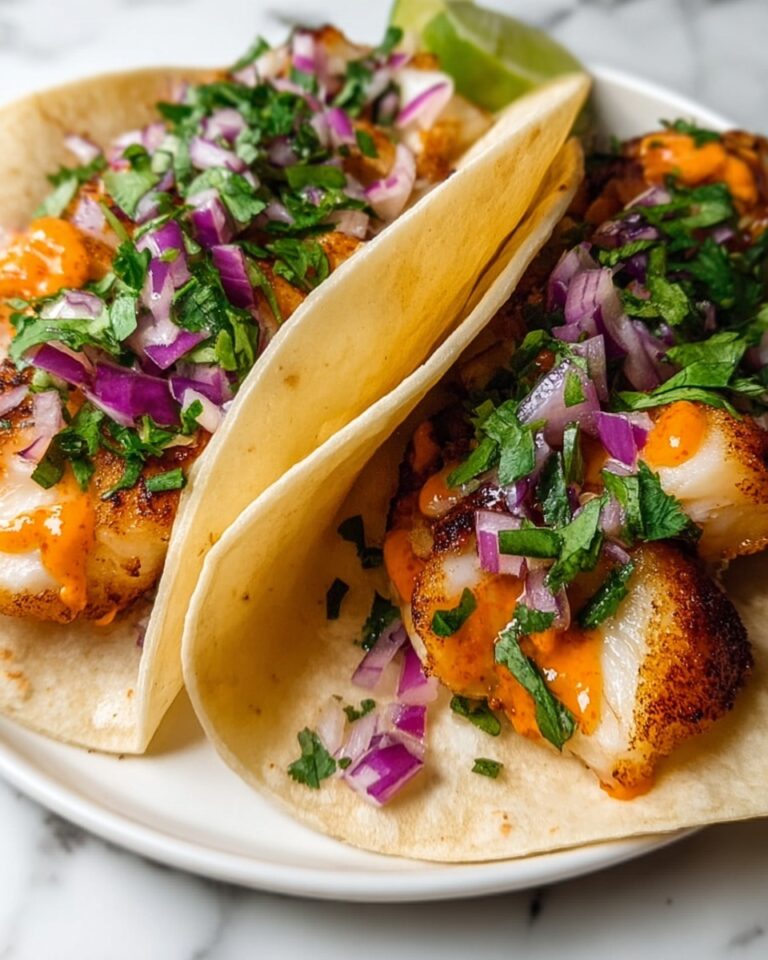 Crispy Fish Tacos with Homemade Slaw and Lime Crema Recipe